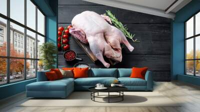 Fresh raw whole duck on black wooden background, with space for text Wall mural