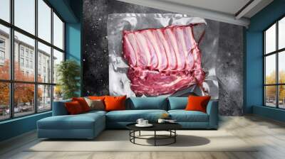 Lamb rib pack, on black dark stone table background, top view flat lay Wall mural