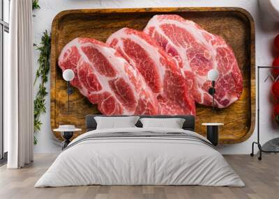 Piece of fresh raw pork from the neck, with ingredients, on white stone table background, top view flat lay Wall mural