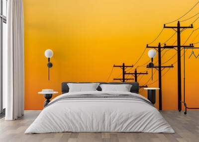 Power lines stretch across the horizon, silhouetted by a stunning orange sunset illuminating the evening sky in a tranquil rural area Wall mural