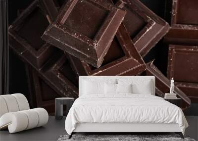 Broken pieces of dark chocolate close up Wall mural