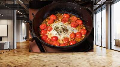 Chef cooking food for italian cuisine, tomato sauce for pasta, mediterranean diet concpet, detailed view of hands and pan with fried tomatoes Wall mural