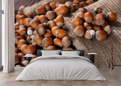 Hazelnuts, filbert on old wooden table. heap or stack of hazel nuts. Hazelnut background, healty food Wall mural