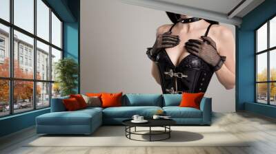 Close-up shot of sexy woman in black fetish corset Wall mural