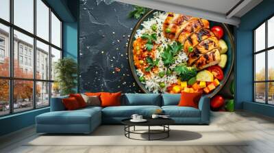 Delicious and fresh roasted slices of curry chicken with rice and vegetables on a dark concrete background Wall mural