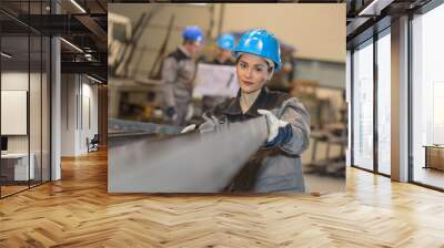 Female worker in the metallic industry Wall mural