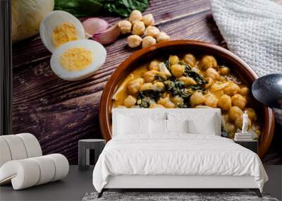 Delicious and traditional dish of chickpea stew with spinach and egg Wall mural