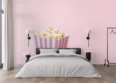 Pop corn striped box and glases for a movie night. Retro scene in pastel colors. Wall mural