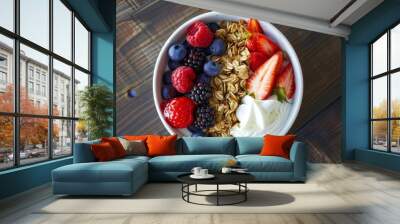 Nourishing breakfast bowl with granola, vibrant fruits, creamy Greek yogurt, and juicy berries, viewed from above. Promotes weight management, healthy habits, and a balanced diet. Wall mural