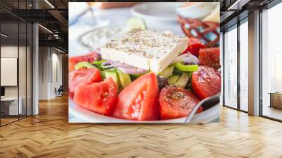 Greek feta salad with tzatziki and bread in the background Wall mural