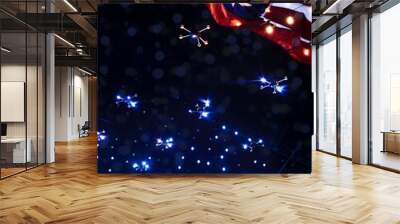 Lit up drones during an air show with red and blue lights for the forth of July. Wall mural