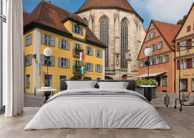 Dinkelsbühl, Bavaria, Germany - July 15, 2019; Colorful houses and the back of the church on a square in Dinkelsbühl an touristic town on the romantic road Wall mural