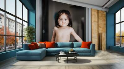 Asian toddler (eighteen months) with diaper in the room. Wall mural