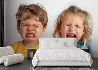 A small capricious child threw a tantrum. Sad unhappy boy cries and screams. Upset negative emotion. Disappointed kid. Upset little children. Brother and sister. Boy and girl, Twins. White background. Wall mural