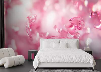 A blurry background with swirling, pink glass pieces that look like they're floating in the air. Wall mural