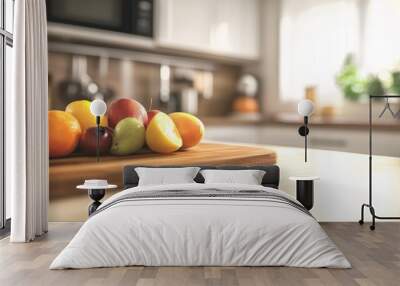 A blurry kitchen scene with fresh fruit on a wooden cutting board. The countertop is white with room for food, drinks, and other items. Wall mural