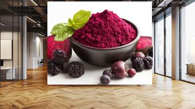 A bowl of beetroot powder sits on a white background, surrounded by fresh fruit. Wall mural