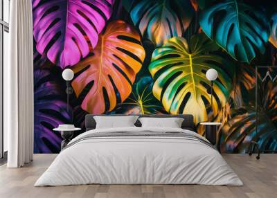 A bright, colorful sign with palm leaves, like a tropical paradise. It glows with the shape of monstera leaves, a beautiful and exotic plant. Wall mural