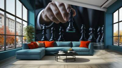 A businessman in a suit is moving a chess piece during a game. This represents success in business, where strategy, teamwork, and leadership are crucial. Wall mural