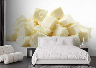 A pile of diced mozzarella cheese, set against a plain white background. Wall mural