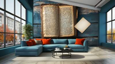 An old, worn book rests on a dark wooden desk. The pages are filled with Hebrew writing, a testament to faith and tradition.  A blank card sits beside it, ready to be filled with new words. Wall mural