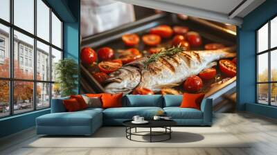 Baking dorado with tomatoes and herbs in the oven.  
The sea bass is done and ready to eat. 
A girl is cooking fish in the kitchen. Wall mural