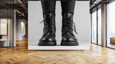 Black boots shown on a plain background. Wall mural