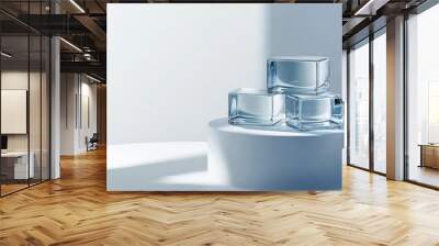 Three glass cubes stacked on a platform against a plain background. This design is perfect for displaying beauty products and offers plenty of space for text or images. Wall mural