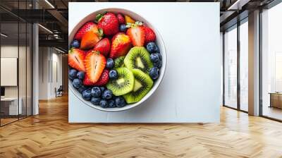 A colorful bowl showcases a delightful mix of strawberries, blueberries, and kiwi, perfect for a healthy snack or dessert Wall mural