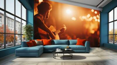 An artist passionately plays guitar on a small stage in a cozy venue. The atmosphere is intimate, with soft lighting highlighting the performance and an attentive crowd Wall mural