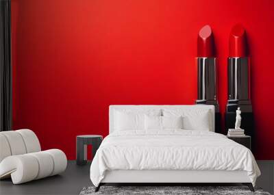 Bold red lipsticks are arranged side by side against a vivid red backdrop, creating an eye-catching display ideal for beauty marketing Wall mural