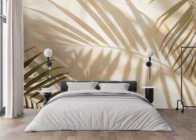 Closeup of blurred shadow of palm tree leaves on light cream wall Wall mural