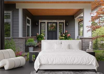 The modern farmhouse features a grey front door, surrounded by vibrant plants and a cozy porch, creating an inviting atmosphere Wall mural