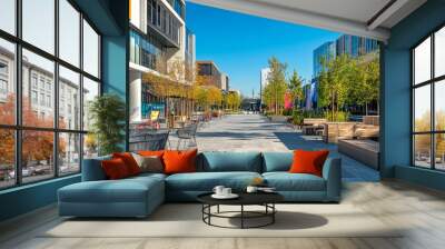 This vibrant urban street features stylish outdoor seating framed by modern architecture and colorful public art, inviting relaxation in an inviting atmosphere Wall mural