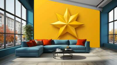 A gold star on a yellow background. Wall mural