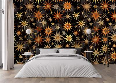 A seamless pattern of gold and orange stars on a black background. Wall mural