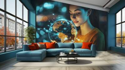 A woman holds a glowing digital globe in her hands, symbolizing global connection and technology. Wall mural