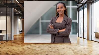 Beautiful african american business woman portrait, arms folded, confident happy CEO Wall mural