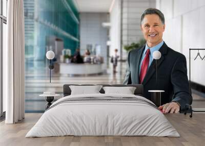 Corporate banking advisor, professional investment manager, businessman, greeting with welcoming smile in building lobby Wall mural