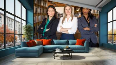 Diverse multiethnic group of business women make strong team powerful stare confident and successful  Wall mural