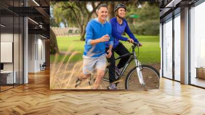 elder couple exercising in the park Wall mural