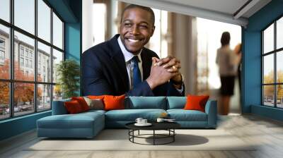 Enthusiastic chic handsome charismatic classy african american CEO in his office smiling confidently  Wall mural