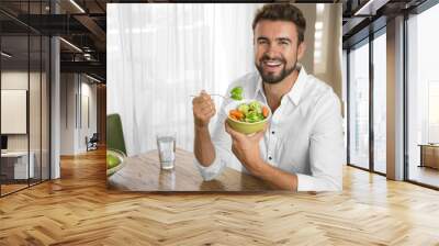 man with perfect skin eating a healthy meal Wall mural