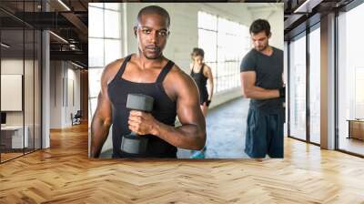 Portrait african american bodybuilder at gym intense intimidating glare expression conviction Wall mural