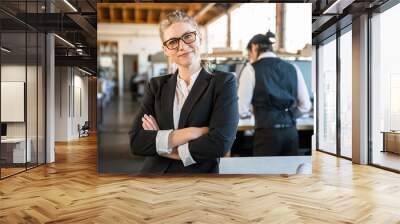 Portrait of a happily employed business woman at her job possibly architect, engineer, creative designer Wall mural