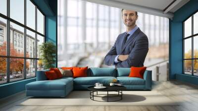 portrait of happy businessman at an airport terminal Wall mural