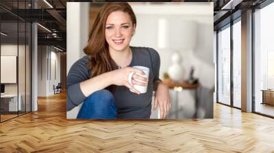 pretty woman relaxing with coffee cup mug at home redhead headshot space modern home living college  Wall mural