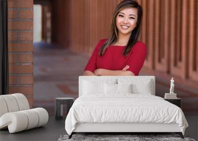 Strong pose from Asian American female career professional with successful confident smile Wall mural