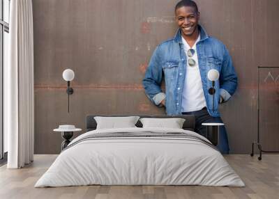 Stylish fashion casual dressed African American male, trendy jeans jacket, happy and cheerful pose Wall mural