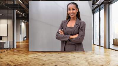 Warm, friendly, beautiful cheerful african american executive business woman at the workspace office Wall mural